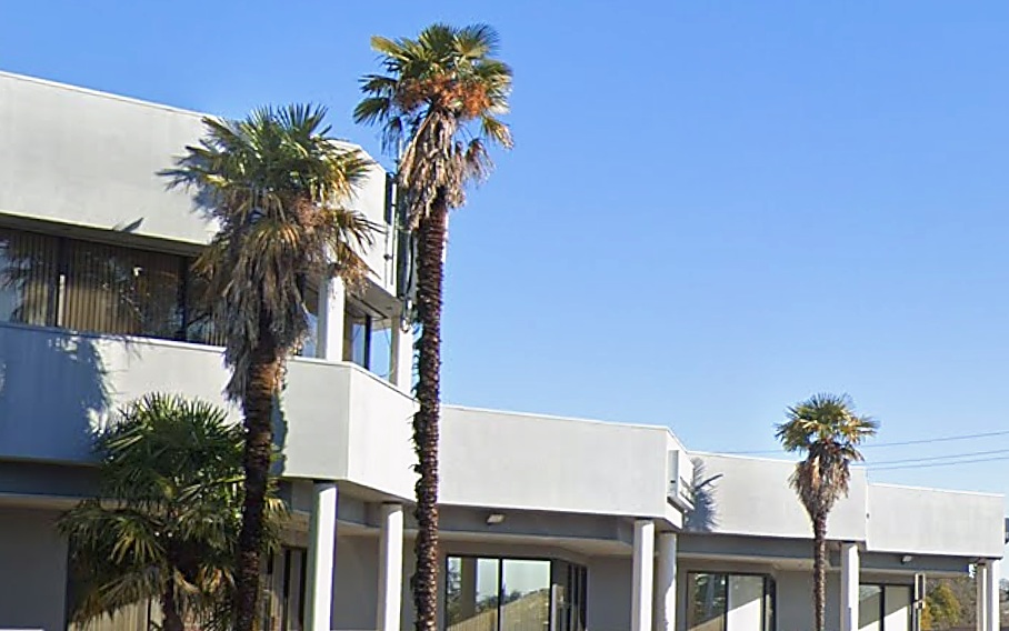 Hazel Ridge exterior with palm trees and professional landscaping